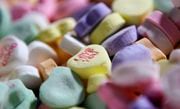 FILE - Colored "Sweethearts" candy conversation hearts are pictured at the New England Confectionery Company (NECCO) in Revere, Mass., on Jan. 14, 2009. (AP Photo/Charles Krupa, File)