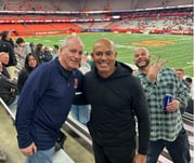 Mariano Rivera, a Hall of Fame closer who pitched for the New York Yankees, poses with fan Dave Verrone (left) at the Syracuse lacrosse game against Manhattan on Friday evening in the JMA Wireless Dome. Rivera’s son, Jaziel, is a junior faceoff specialist for the Jaspers. Photo courtesy of Dave Verrone